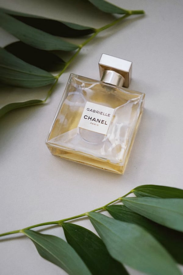 Perfume on table with decorative background